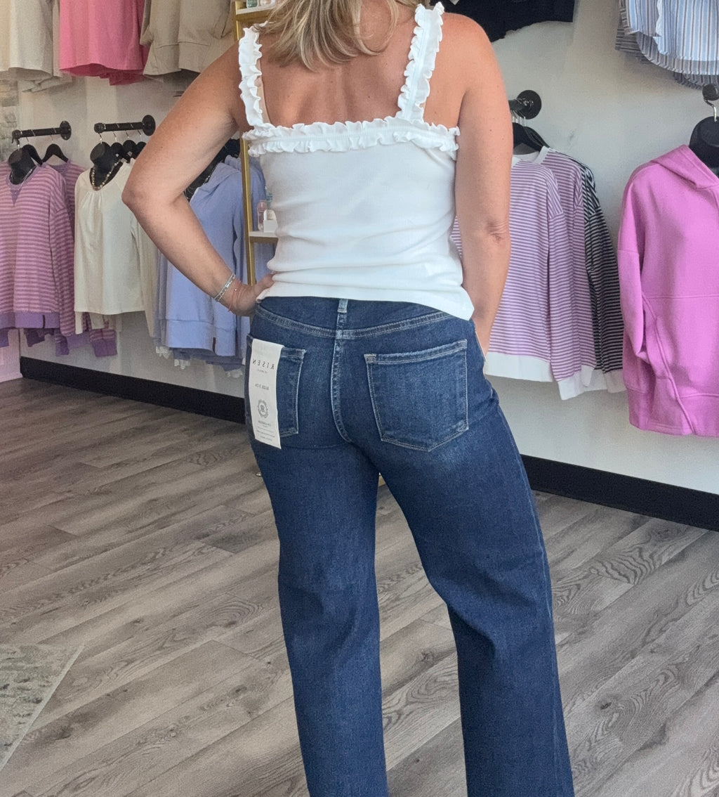dark wash denim jeans with frayed hem.  
