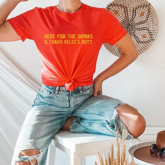 Here For The Drinks and Travis Kelce's Butt Graphic Tee